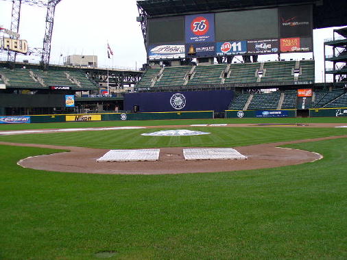 Behind home plate.