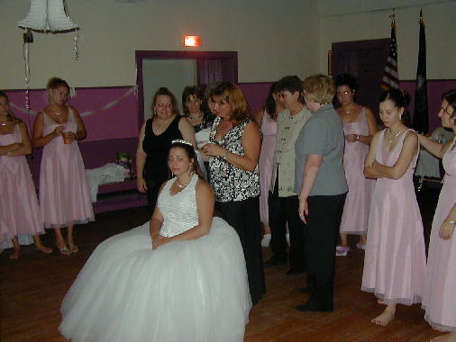 Andrea removes the veil.