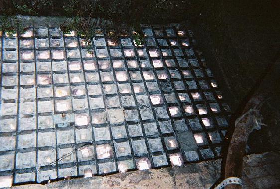 Skylight in the sidewalk.