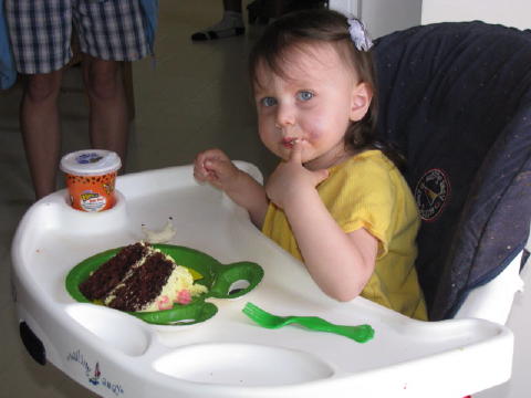 Anna enjoys the icing.