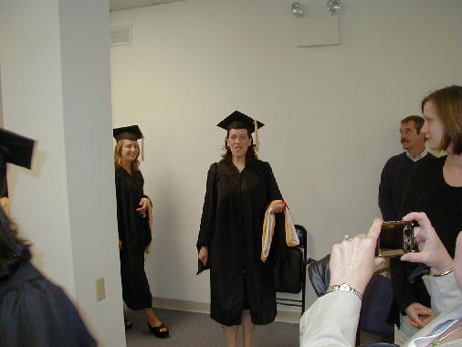 Ann enters the hall.