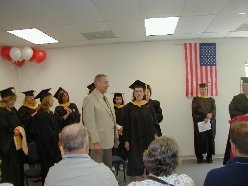 Ann gets hooded.