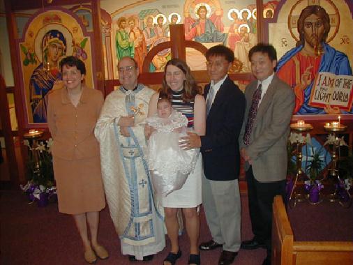 Father Ron, Eileen, the parents and godparents.