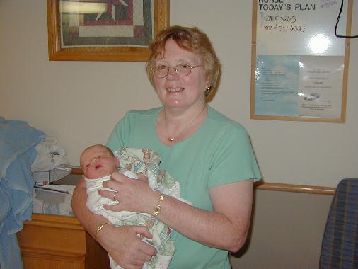 Grammie holds Michael for the first time.