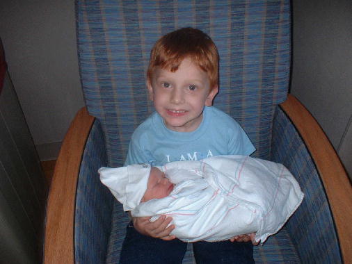 Charles gets a chance to hold Michael.