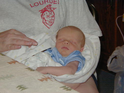 Michael snuggles with his Mom.