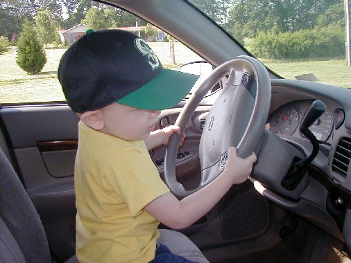 He looks comfortable behind the wheel.