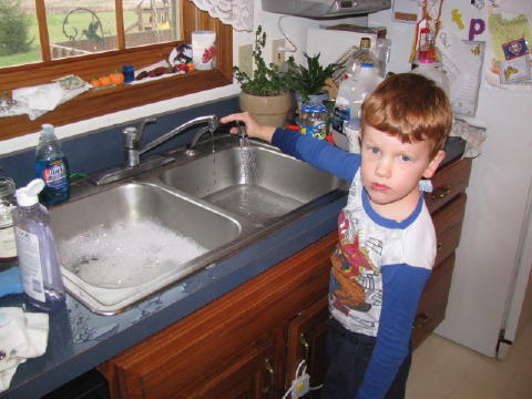 Doing his chores.