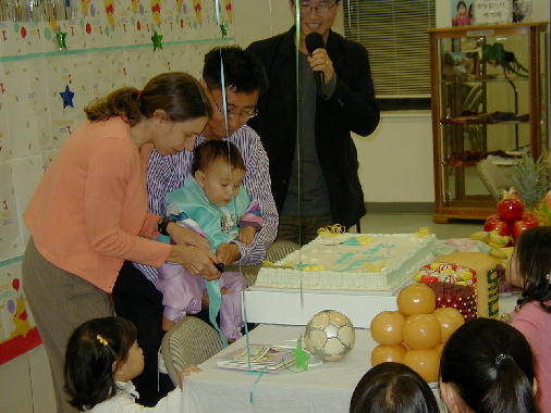 Cutting the first piece of cake.