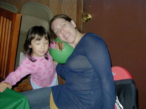 Eileen and Annie wait for the cutting of the cake.