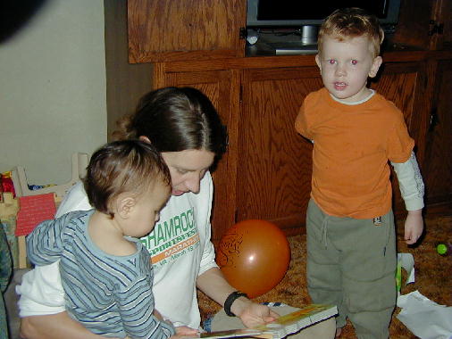 The two Michaels listen as Colleen reads.