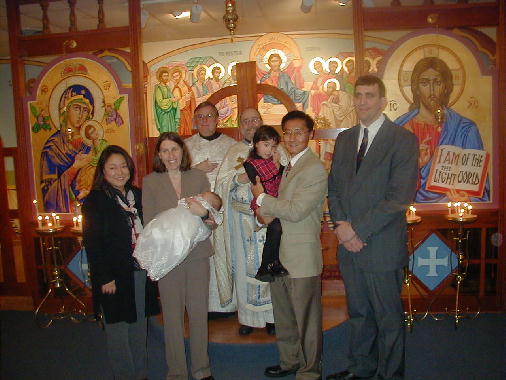 The godparents join the picture.