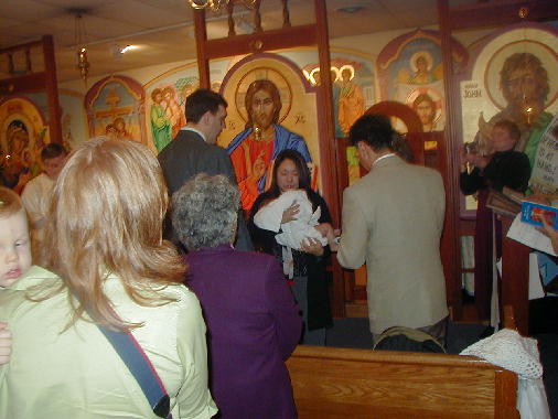 Elaine dries Michael after the christening.