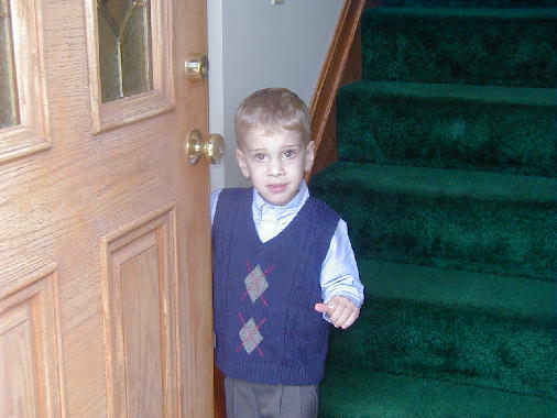 Tommy welcomes everyone into the house.