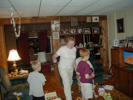 Grammie skips around the room with the kids.