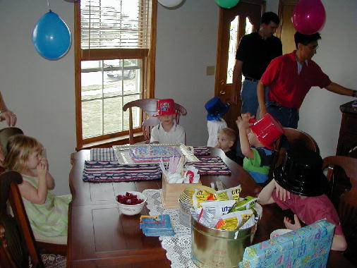 Gathering around the cake.