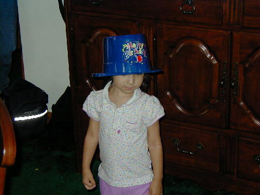 Eileen fashions the birthday hat.