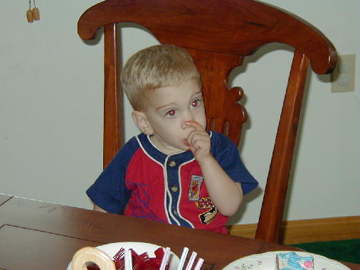 Tommy tries a chocolate flavored thumb.