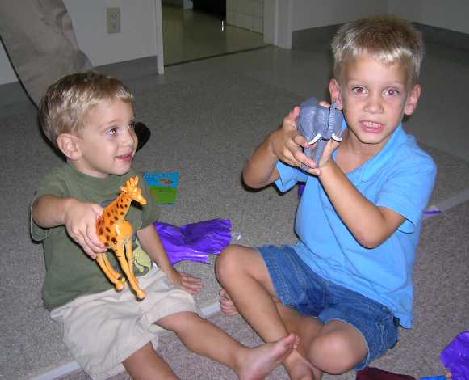 The boys with their favorite animals.