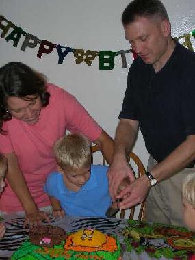 Cutting the cake with Mom and Dad.