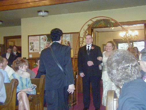 Michael escorts Cathy into church.