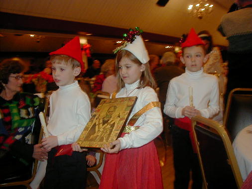 Leading the procession.